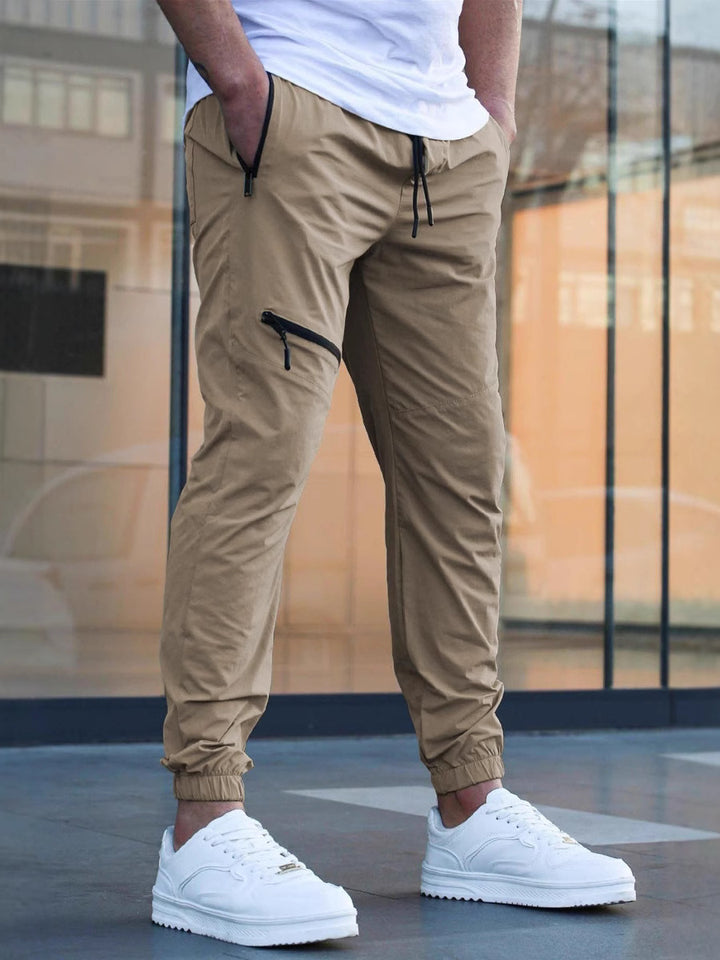 Men's sporty jogging pants with practical zip pockets and elastic waistband Lisslune