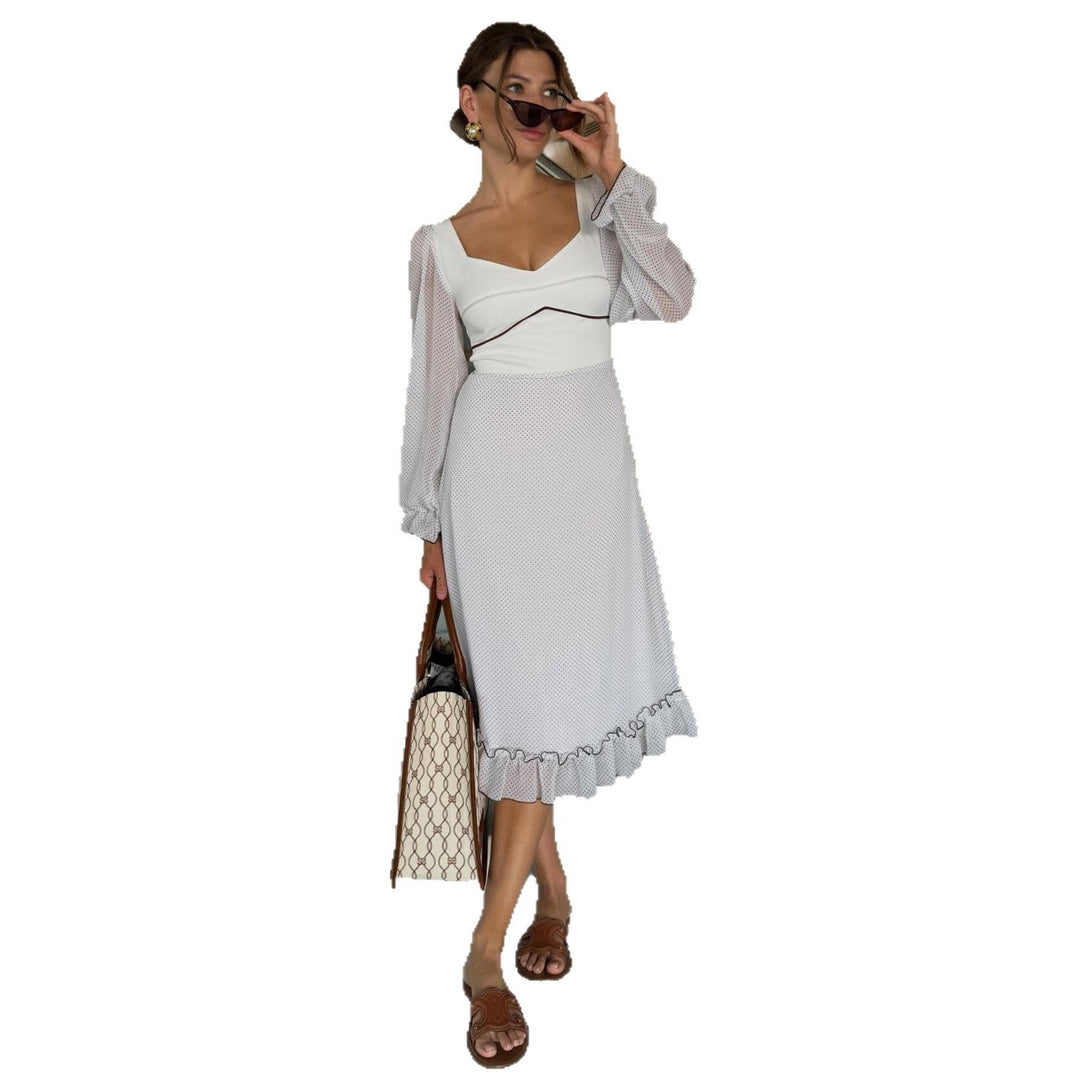 Women's midi dress with voluminous puff sleeves and playful ruffle hem
