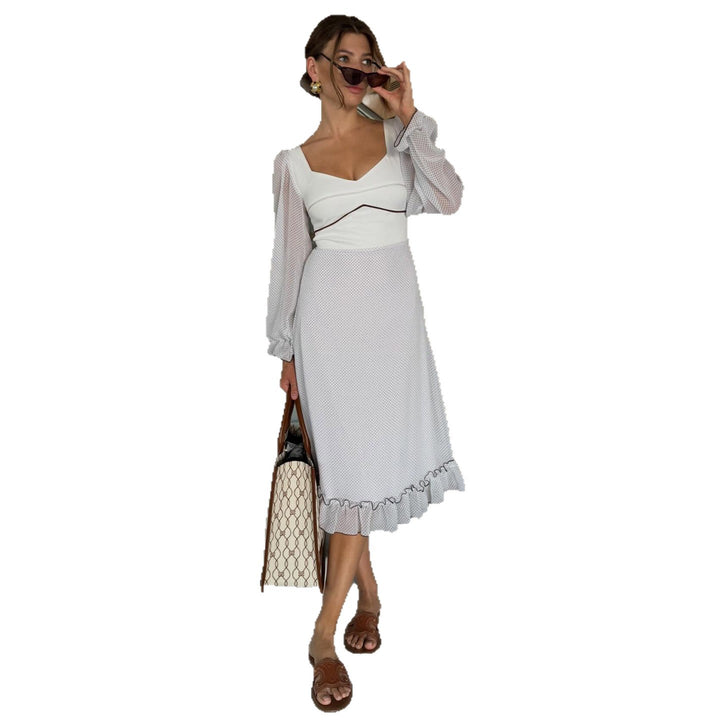 Women's midi dress with voluminous puff sleeves and playful ruffle hem