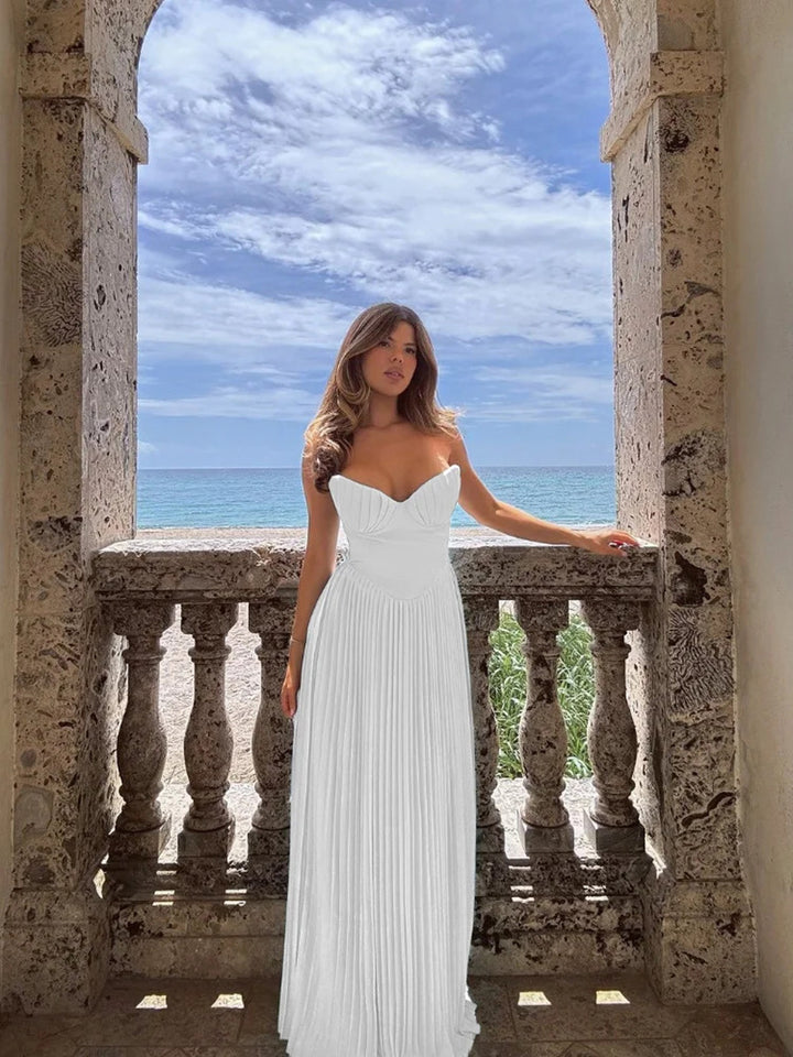 Women’s pleated dress with deep heart-shaped neckline and flowing skirt Lisslune
