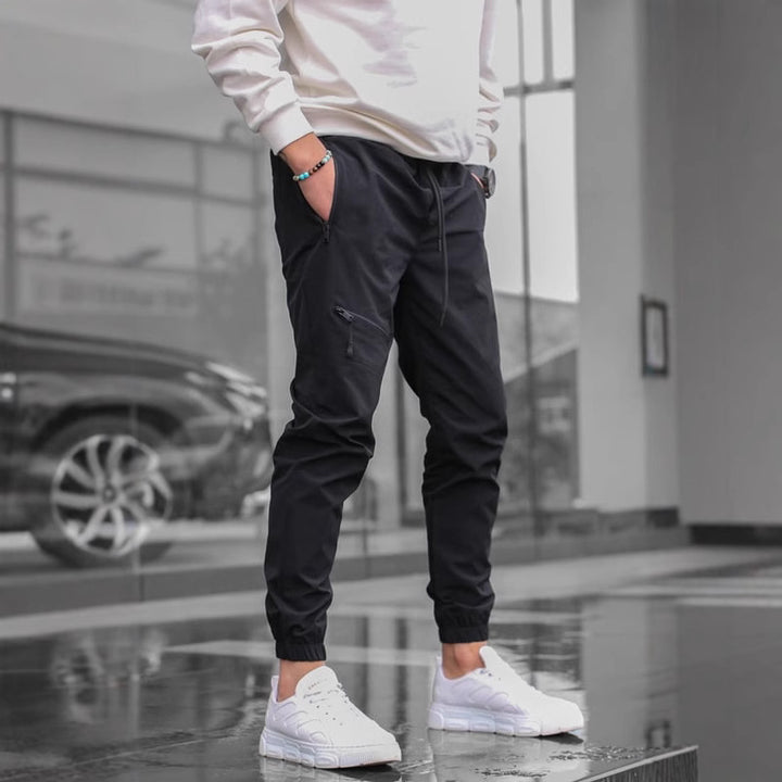 Men's sporty suit pants with elastic waistband and side zip pockets Lisslune