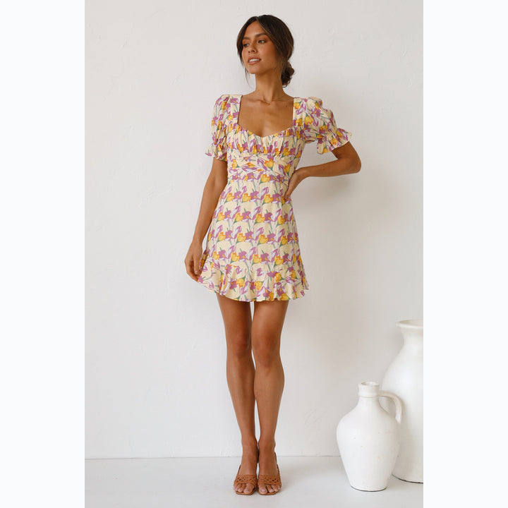 Women's mini dress with voluminous sleeves and playful ruffled hem