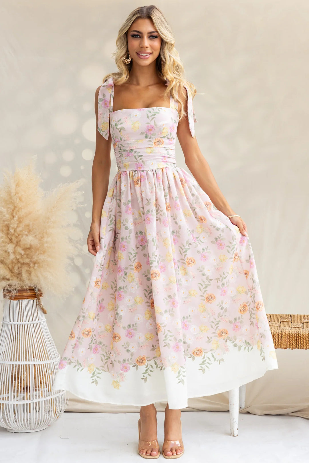 Women's maxi dress with playful straps and floral print
