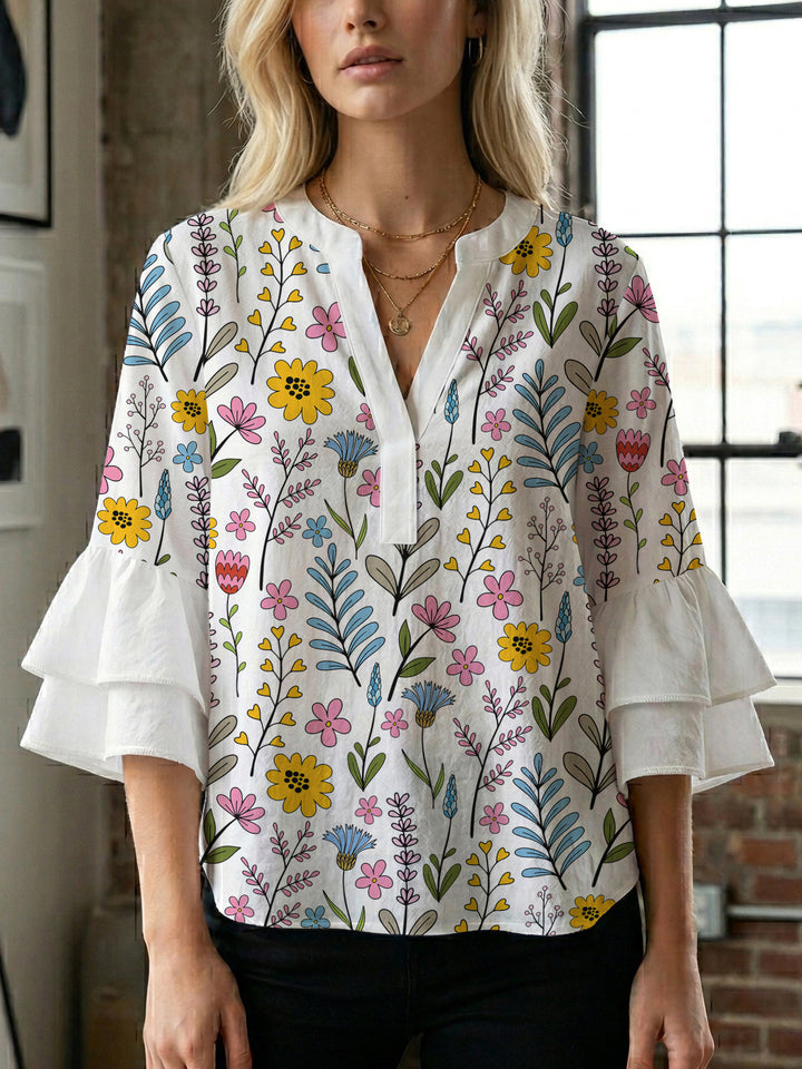 Women’s blouse with voluminous ruffled sleeves and floral pattern Lisslune