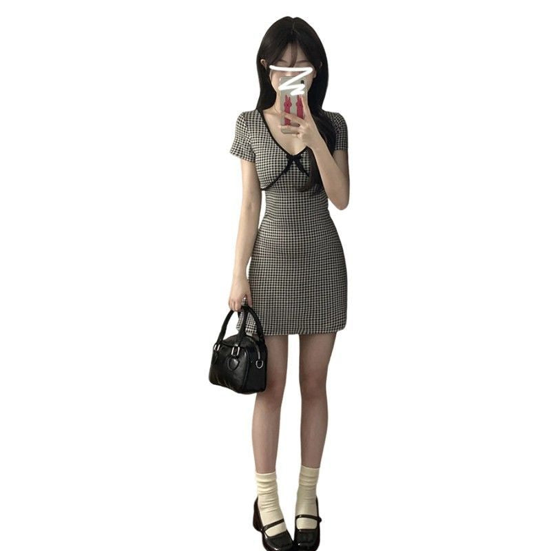 Ladies plaid mini dress with ruffle details and deep V-neck