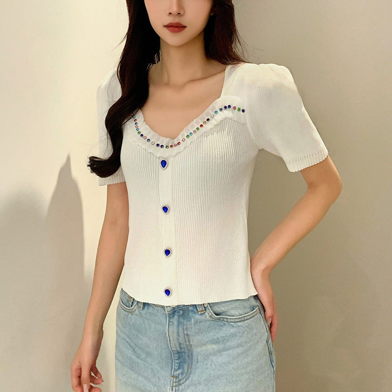 Women's fitted top with decorative button placket and fashionable V-neck