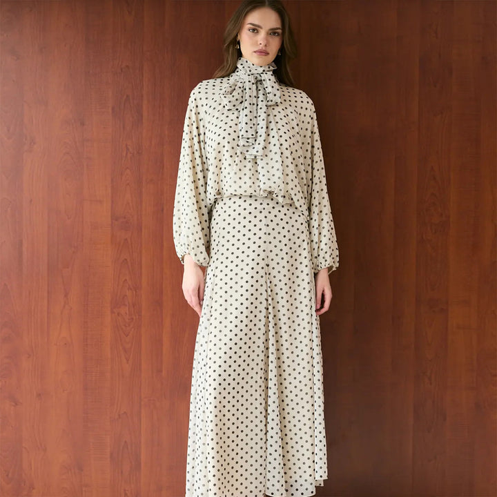 Women’s dress with elegant stand-up collar and playful polka dot design