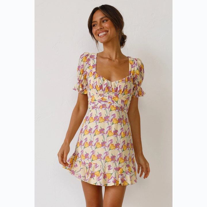 Women's mini dress with voluminous sleeves and playful ruffled hem