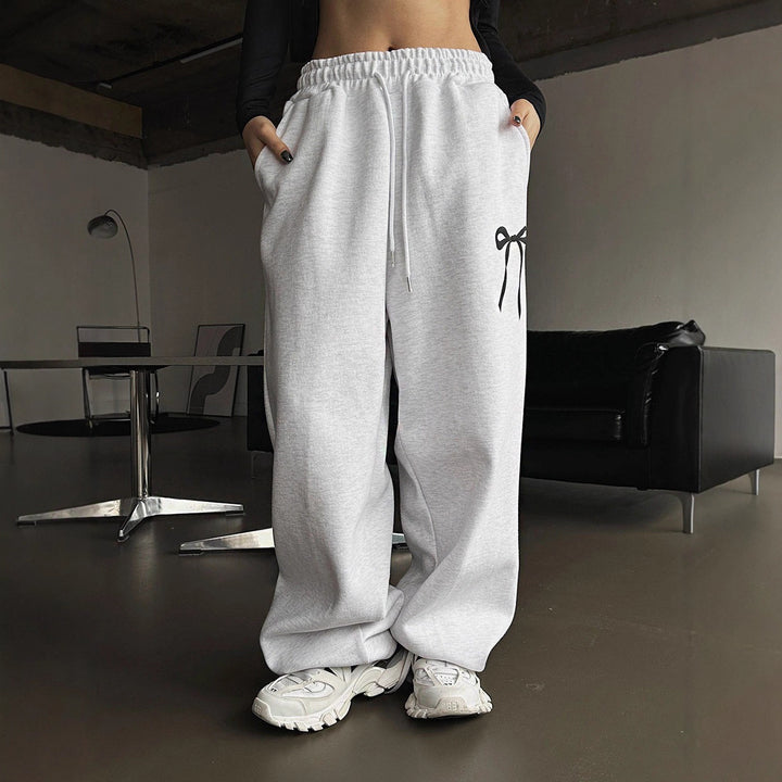 Women's loose leisure pants with elastic waistband and decorative bow motif Lisslune