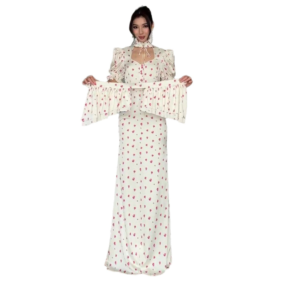 Women's maxi dress with romantic puff sleeve design and playful ruffle hem