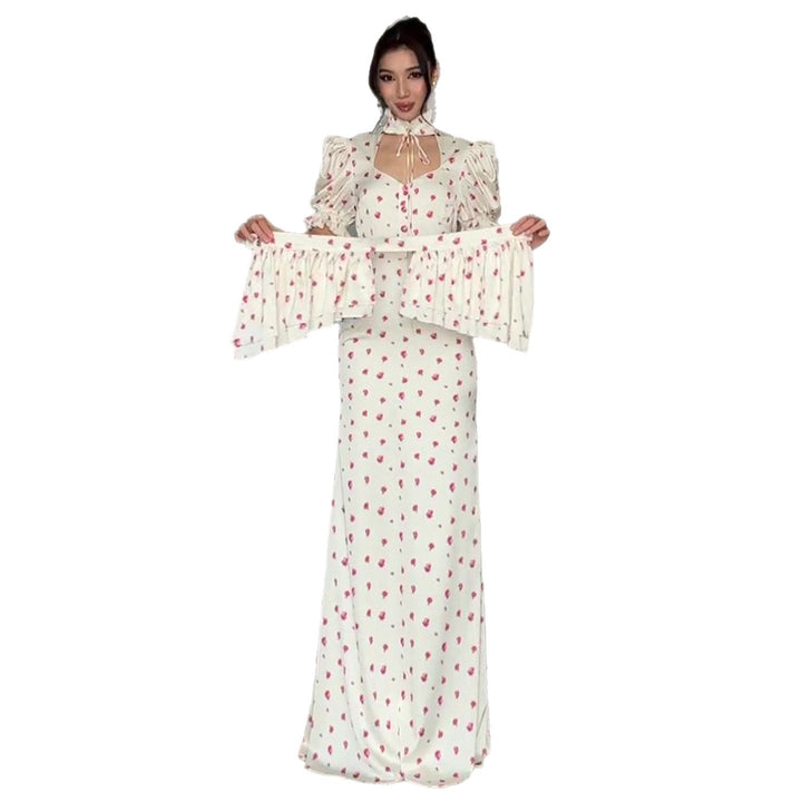 Women's maxi dress with romantic puff sleeve design and playful ruffle hem