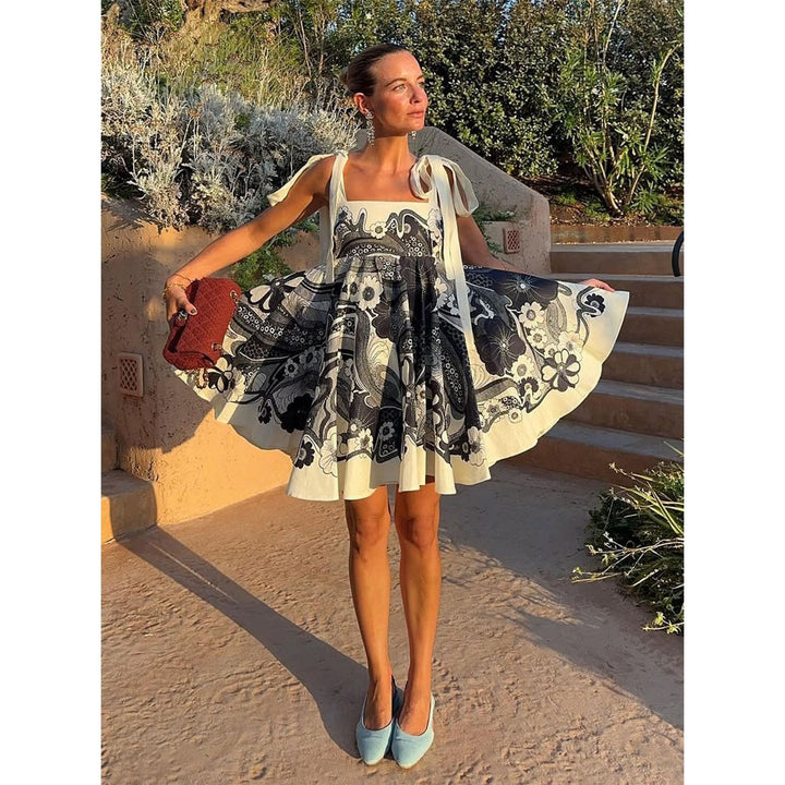 Women's summery mini dress with playful pattern mix and flowy cut Lune London