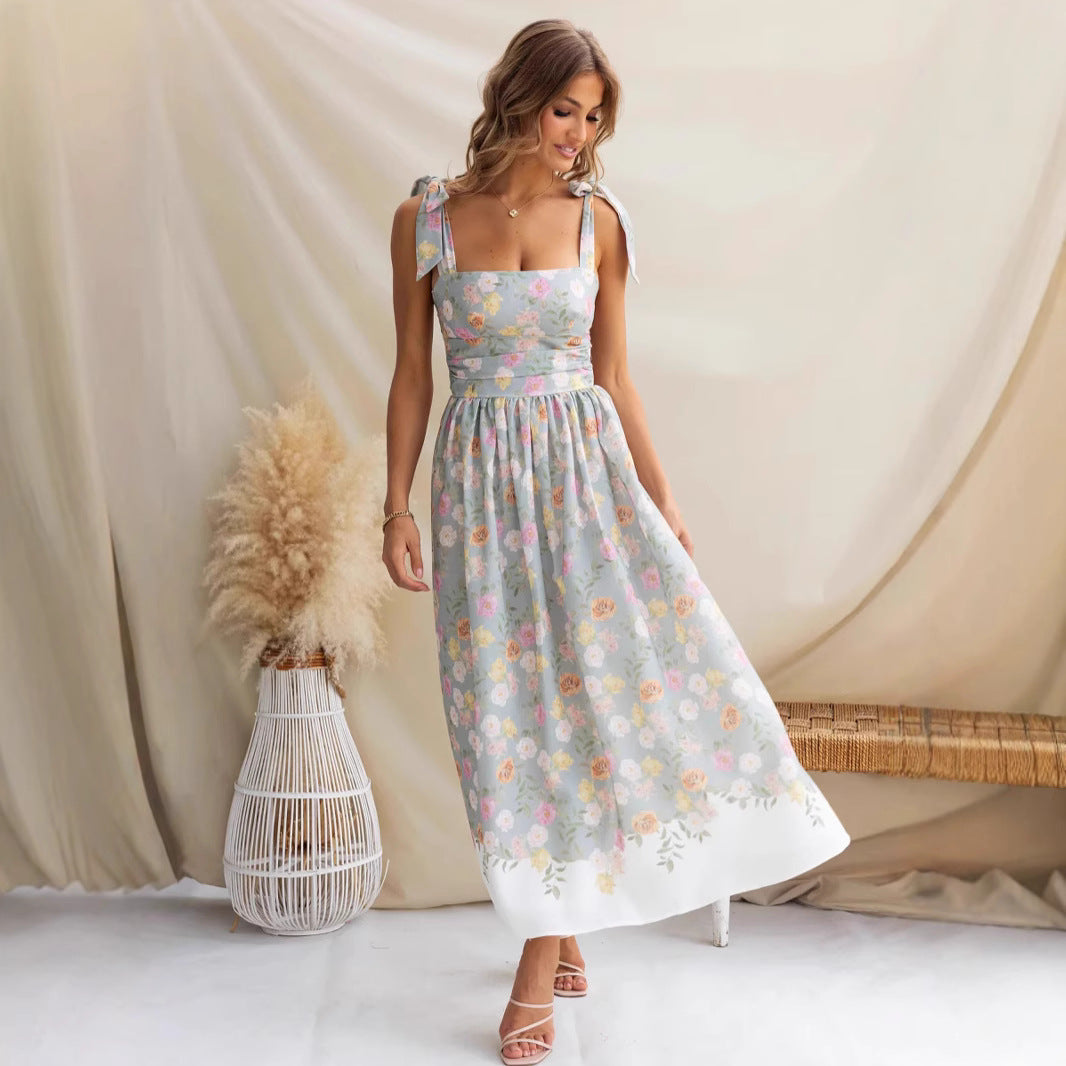 Women's maxi dress with playful straps and floral print