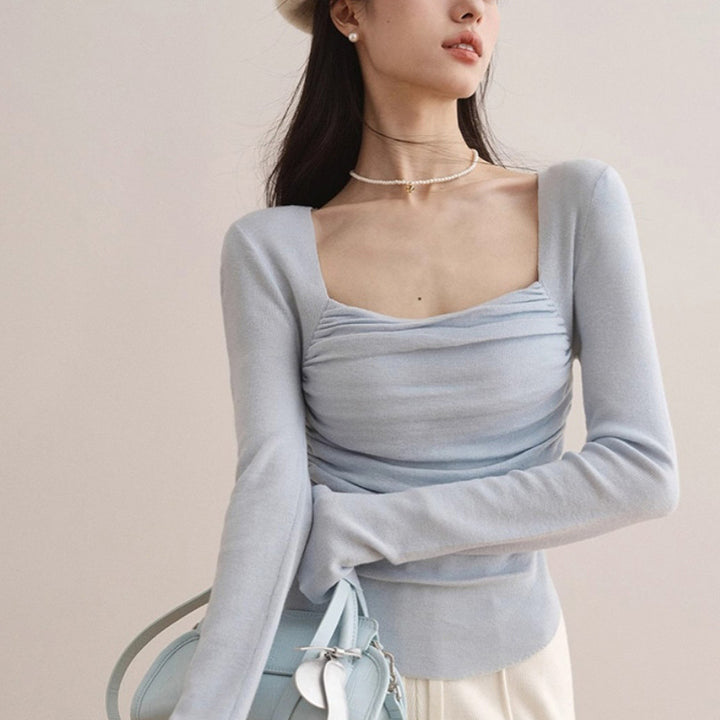 Women's fitted top with elegant gathering effect