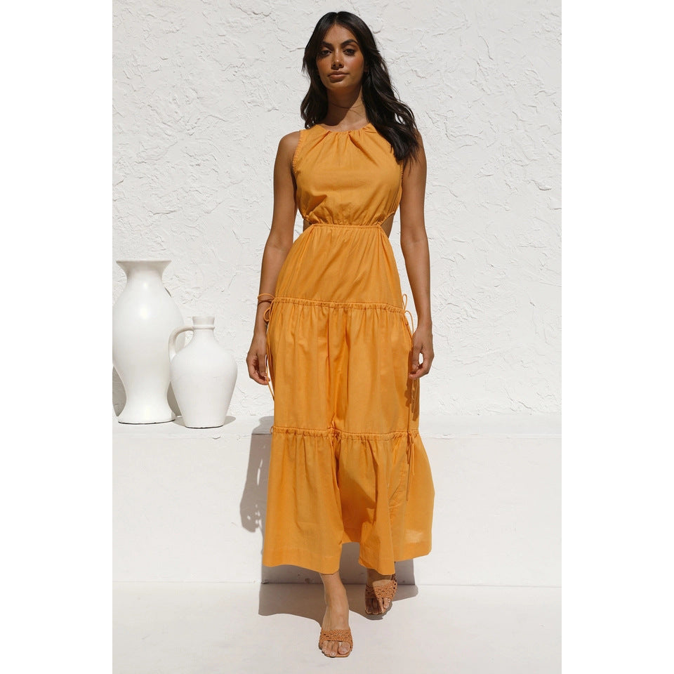 Women’s long sleeve maxi dress with playful side cutouts and flowing skirt Lune London