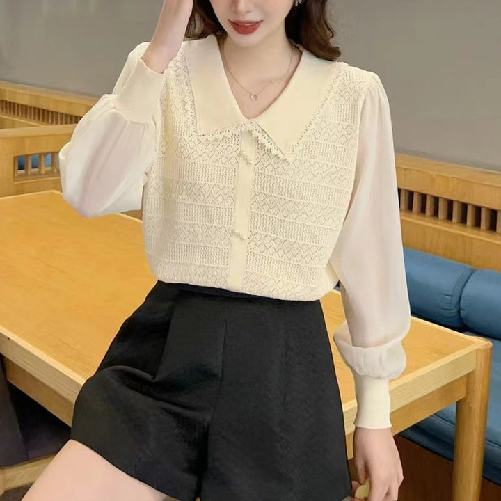 Women's blouse with lace collar and decorative buttons