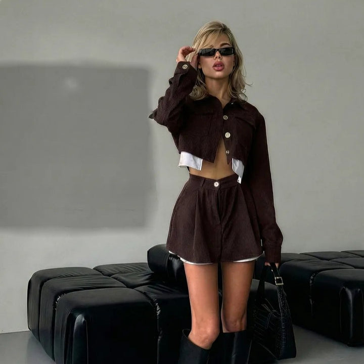 Women's stylish corduroy suit set with short jacket and flared skirt