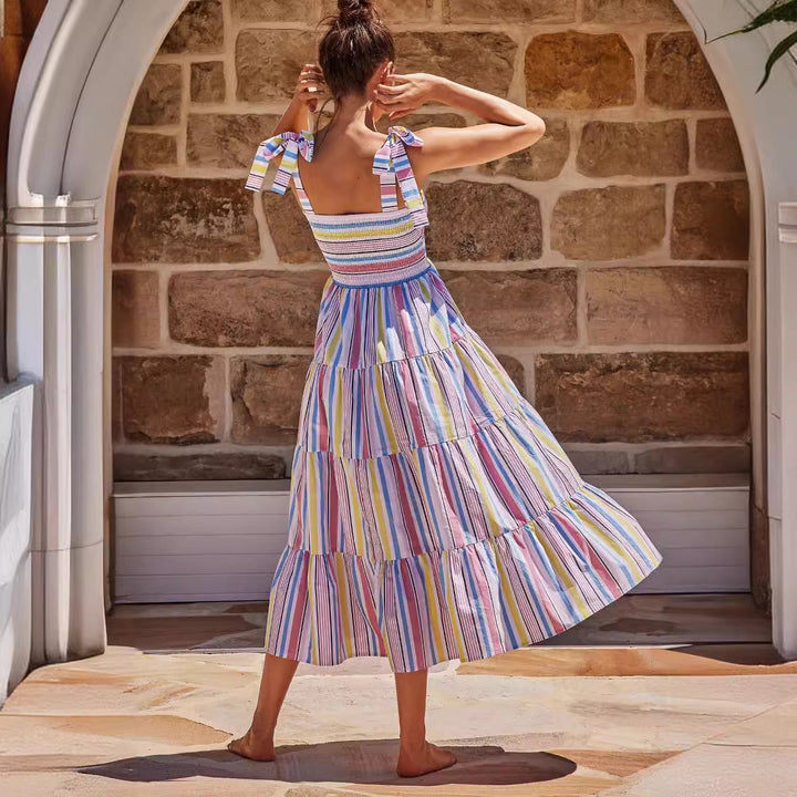 Women's maxi dress with flattering smocked top and playful straps
