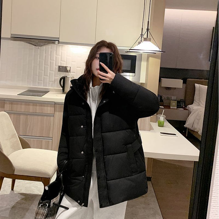 Women's quilted winter jacket with high collar and side pockets