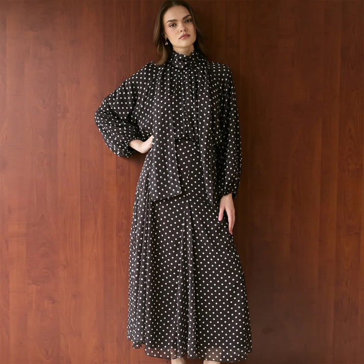 Women’s dress with elegant stand-up collar and playful polka dot design