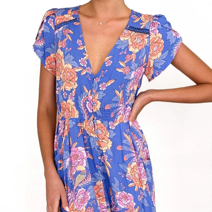Women's maxi dress with elegant V-neckline and feminine ruffle details