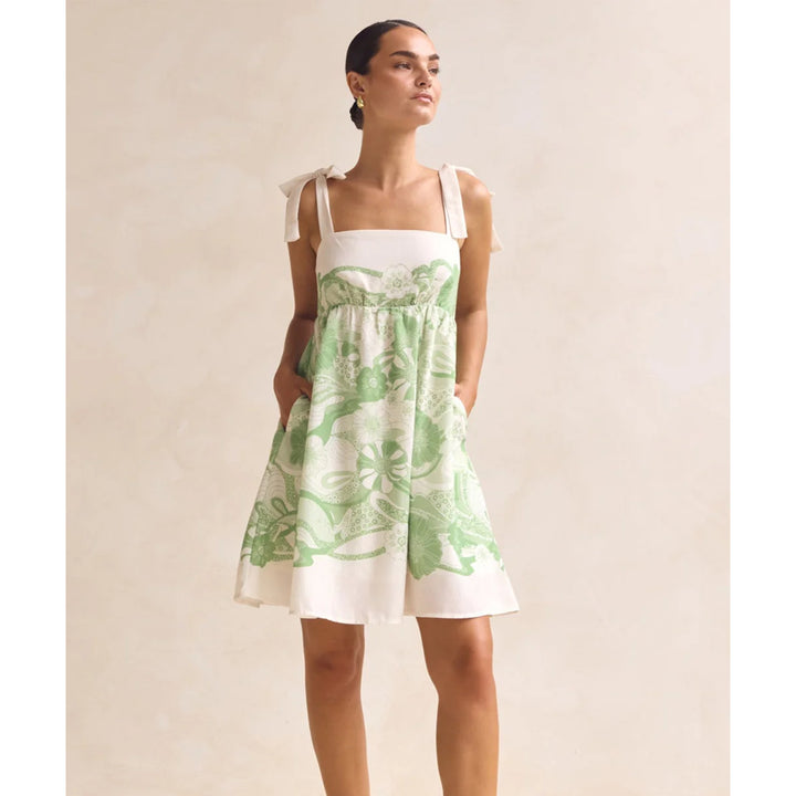 Women's summery mini dress with playful pattern mix and flowy cut Lune London