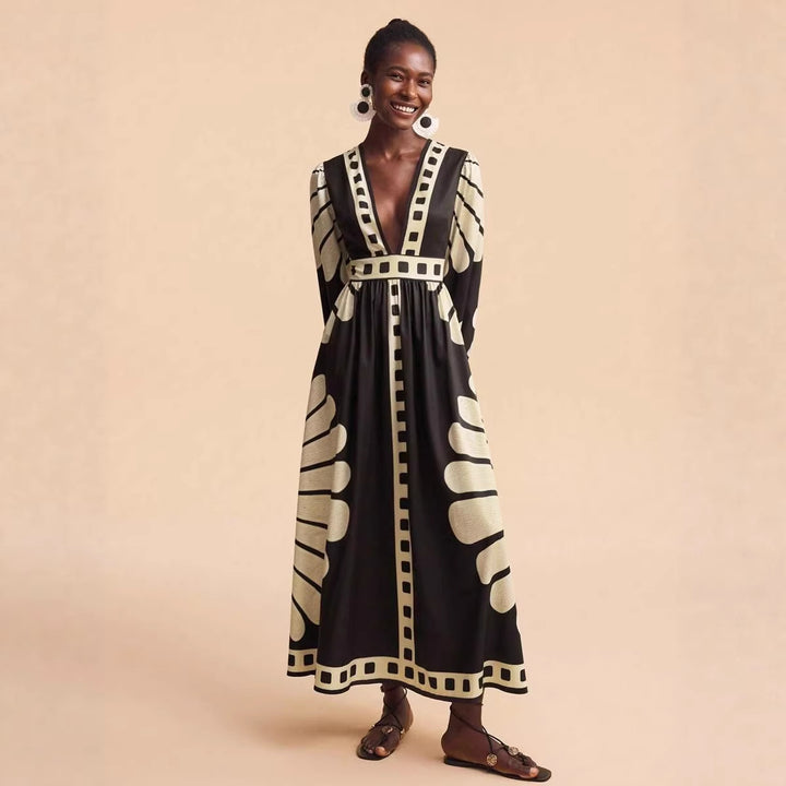 Women's maxi dress with deep V-neck and extravagant sleeve designs Lune London