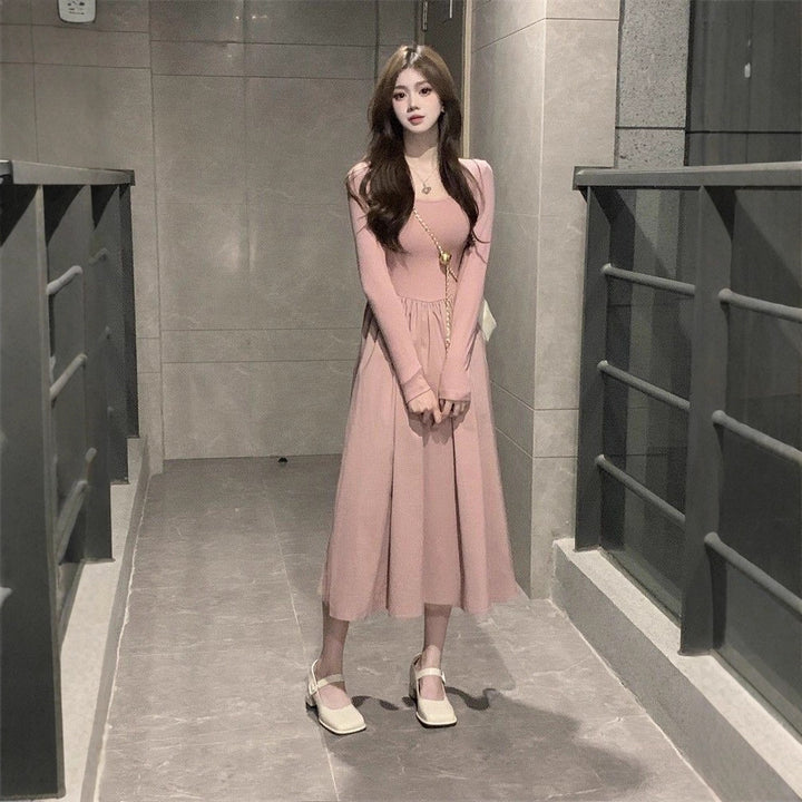 Women long-sleeved midi dress with flared skirt and decorative puff sleeves