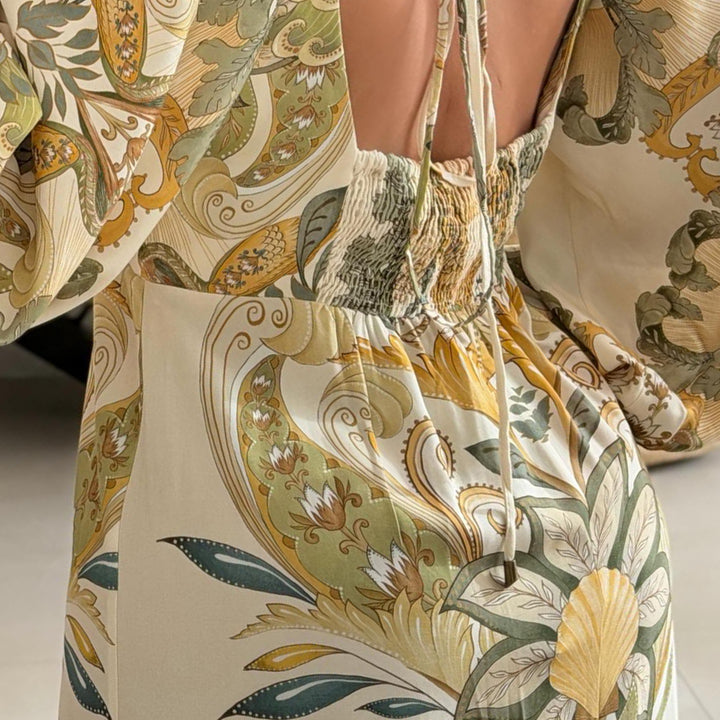Ladies maxi dress with intricate floral design and deep V-neck