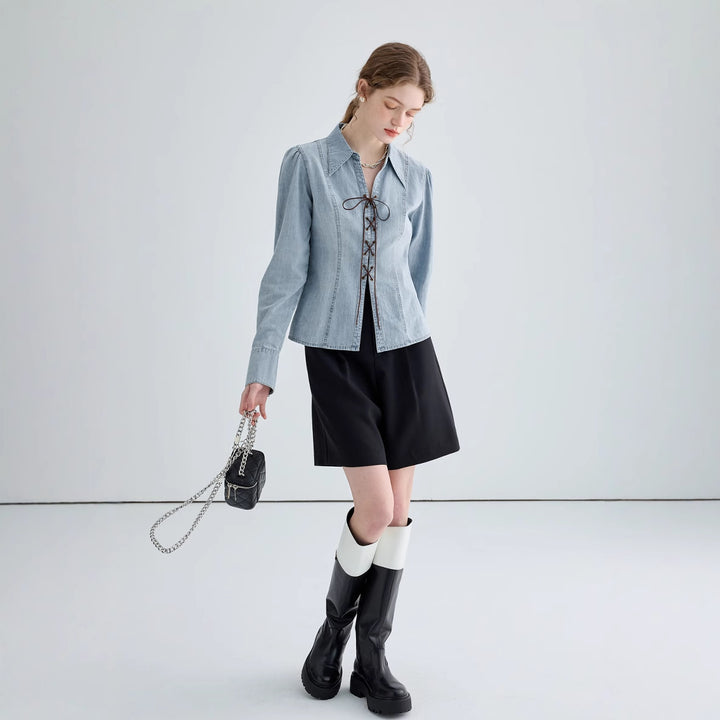 Ladies' jeans blouse with playful lacing details and elegant cut
