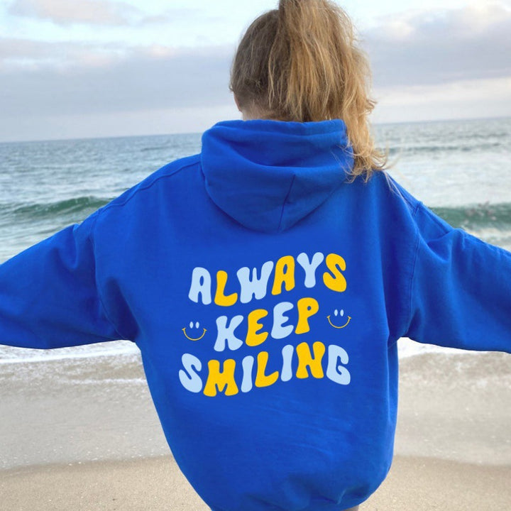 Ladies hoodie with cheerful lettering and practical kangaroo pockets Lisslune