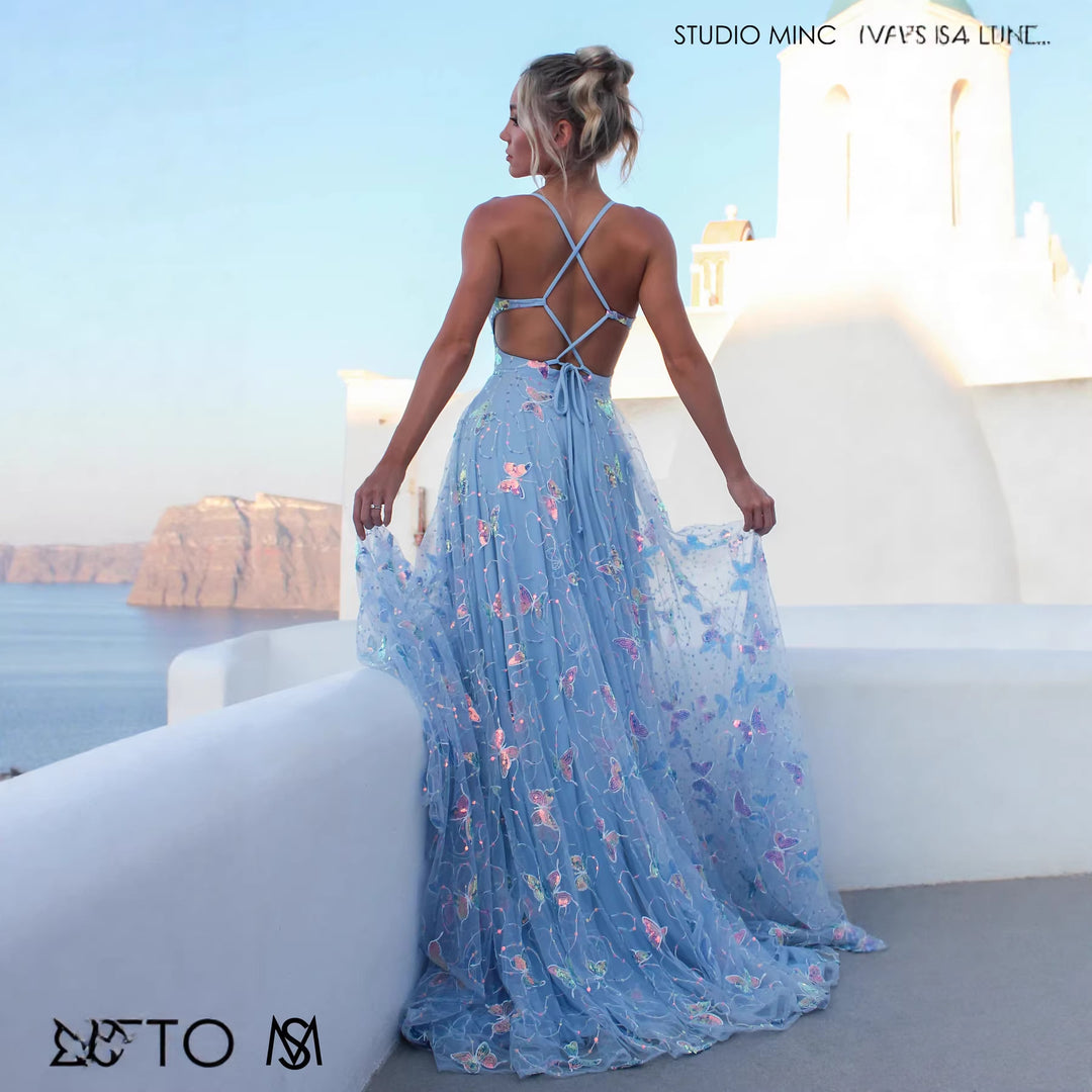 Ladies maxi dress with delicate glitter accents and floral cut
