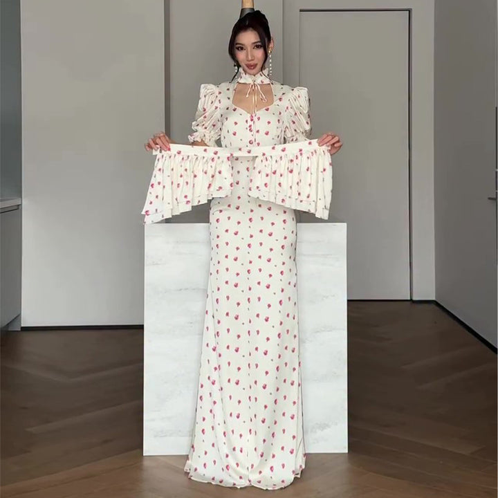 Women's maxi dress with romantic puff sleeve design and playful ruffle hem