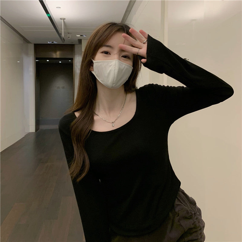 Women's long sleeve shirt with a stylish round neckline and fitted cut