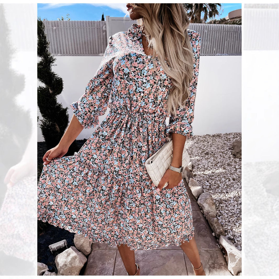 Women's floral dress with playful ruffle details and knee-length cut
