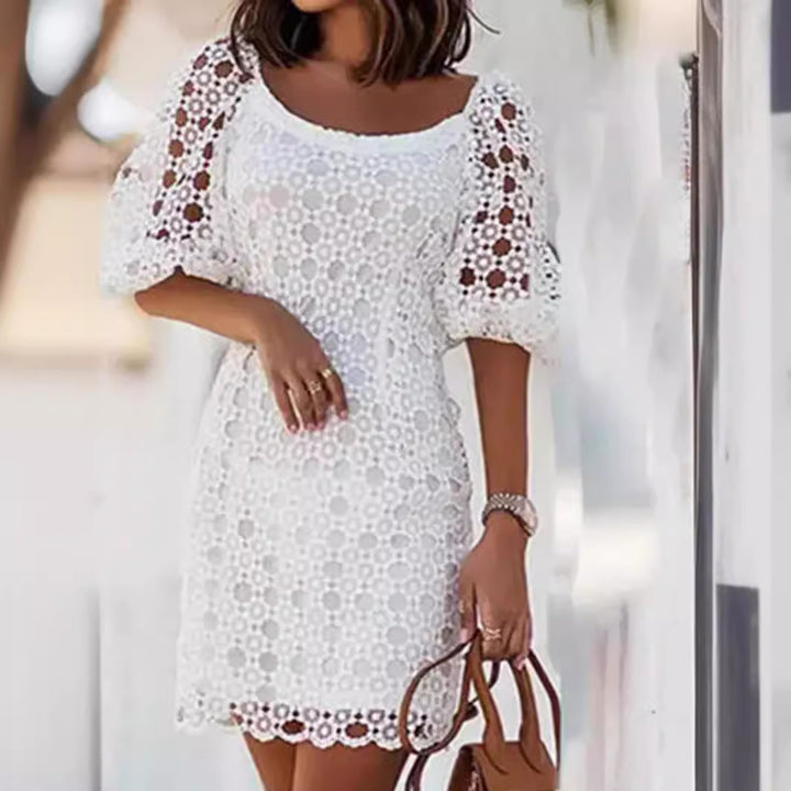 Ladies lace dress with airy puff sleeves and elegant crochet details