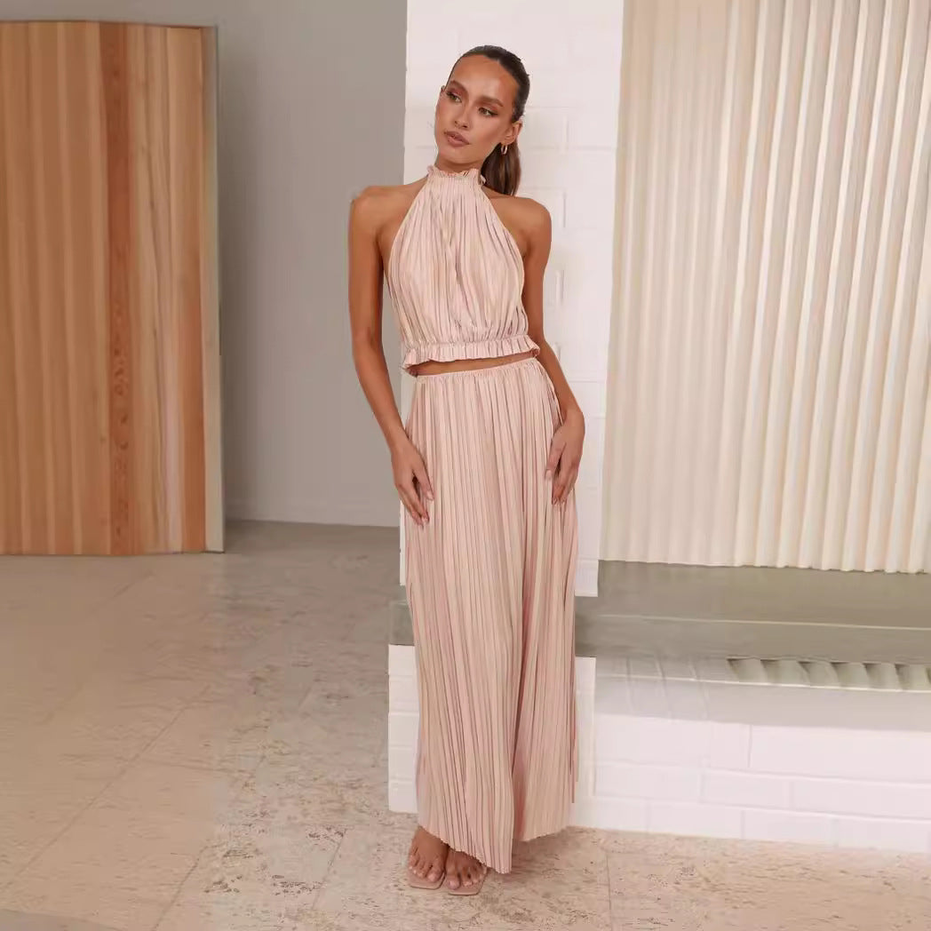 Women's maxi dress with expressive pleated skirt and stylish halter neck Lune London