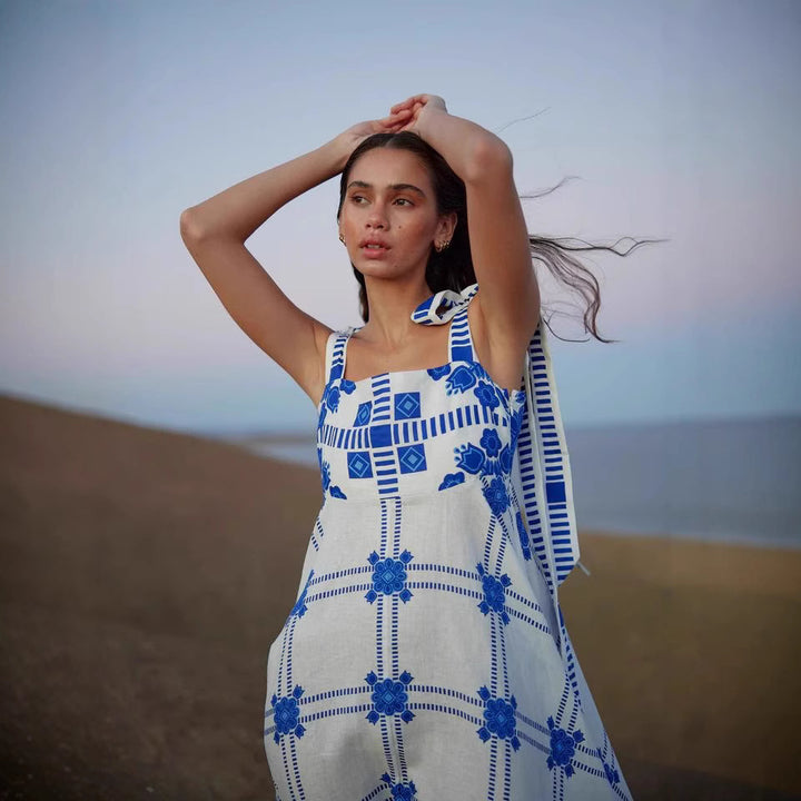 Women's maxi dress with playful check pattern and innovative strap details