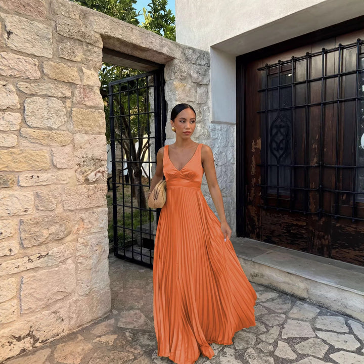Women's pleated dress with deep V-neckline and elegant silhouette