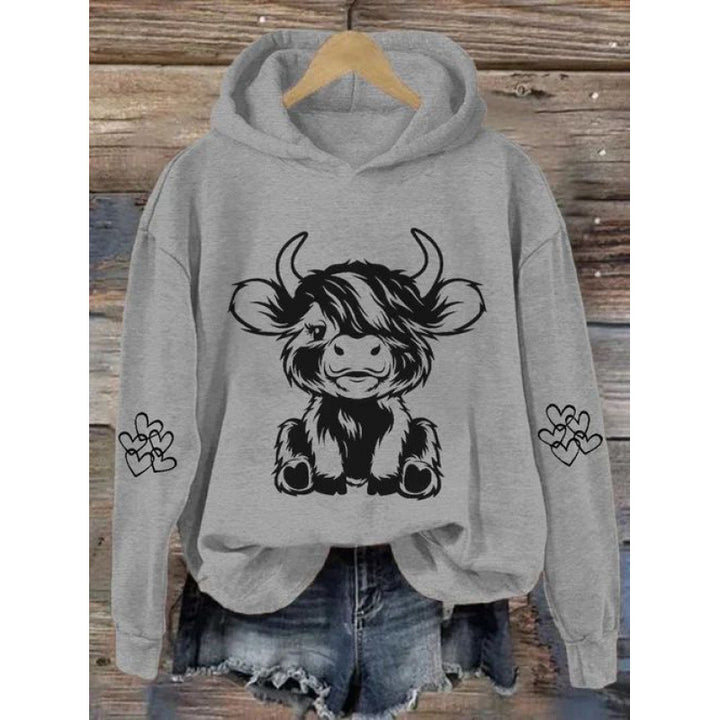Women's hooded sweatshirt with charming cow motif and practical kangaroo pockets Lisslune