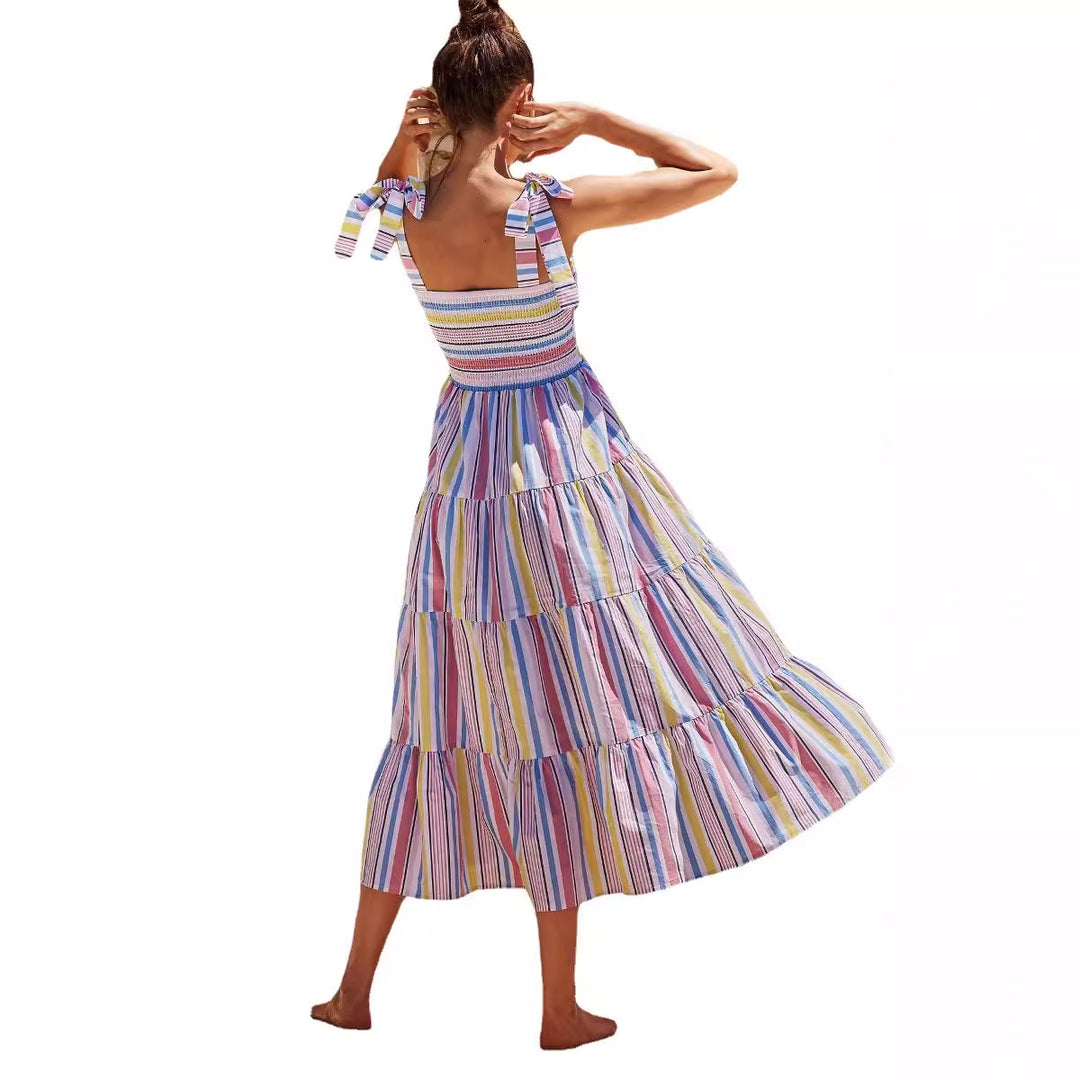Women's maxi dress with flattering smocked top and playful straps