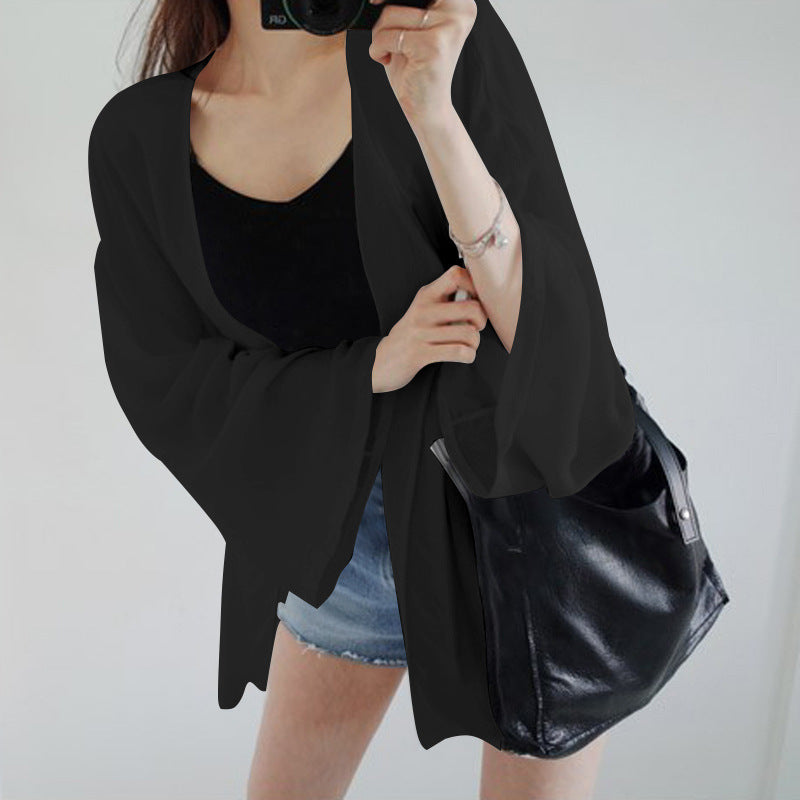Ladies elegant kimono jacket with a loose fit and intricately designed sleeves
