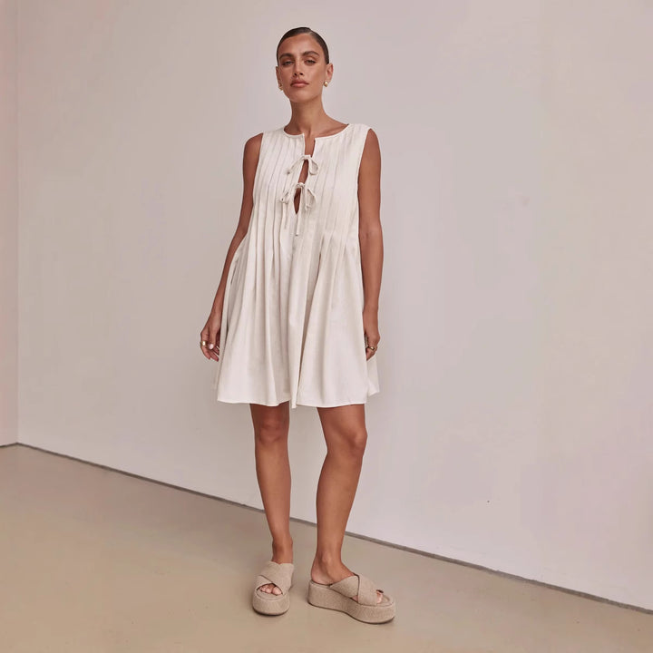 Ladies A-line dress with playful knot and refined pleats Lune London