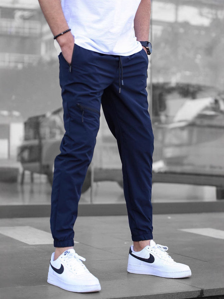 Men's sporty jogging pants with practical zip pockets and elastic waistband Lisslune