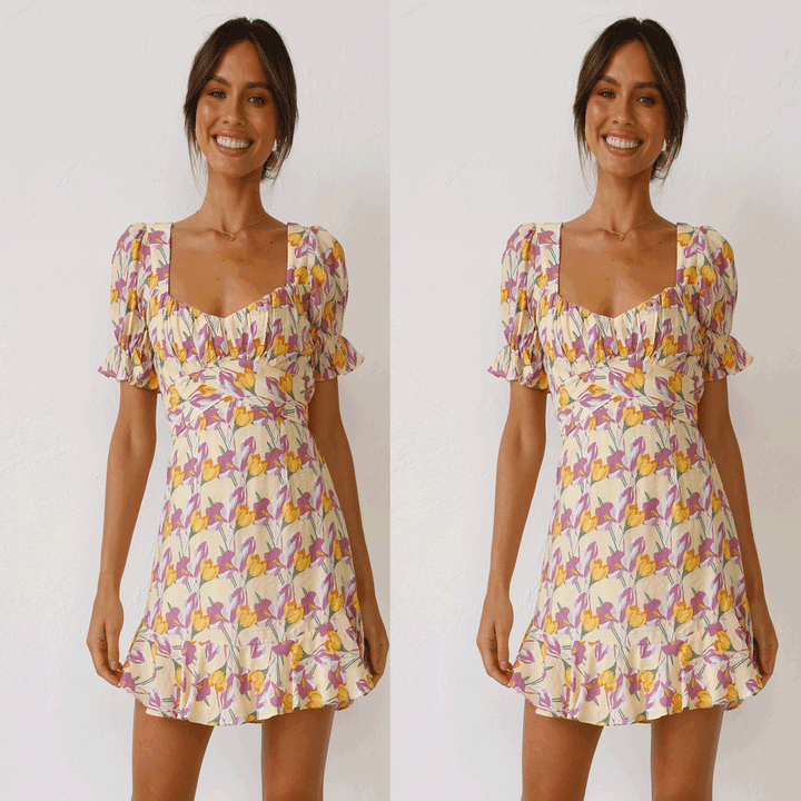 Women's mini dress with voluminous sleeves and playful ruffled hem