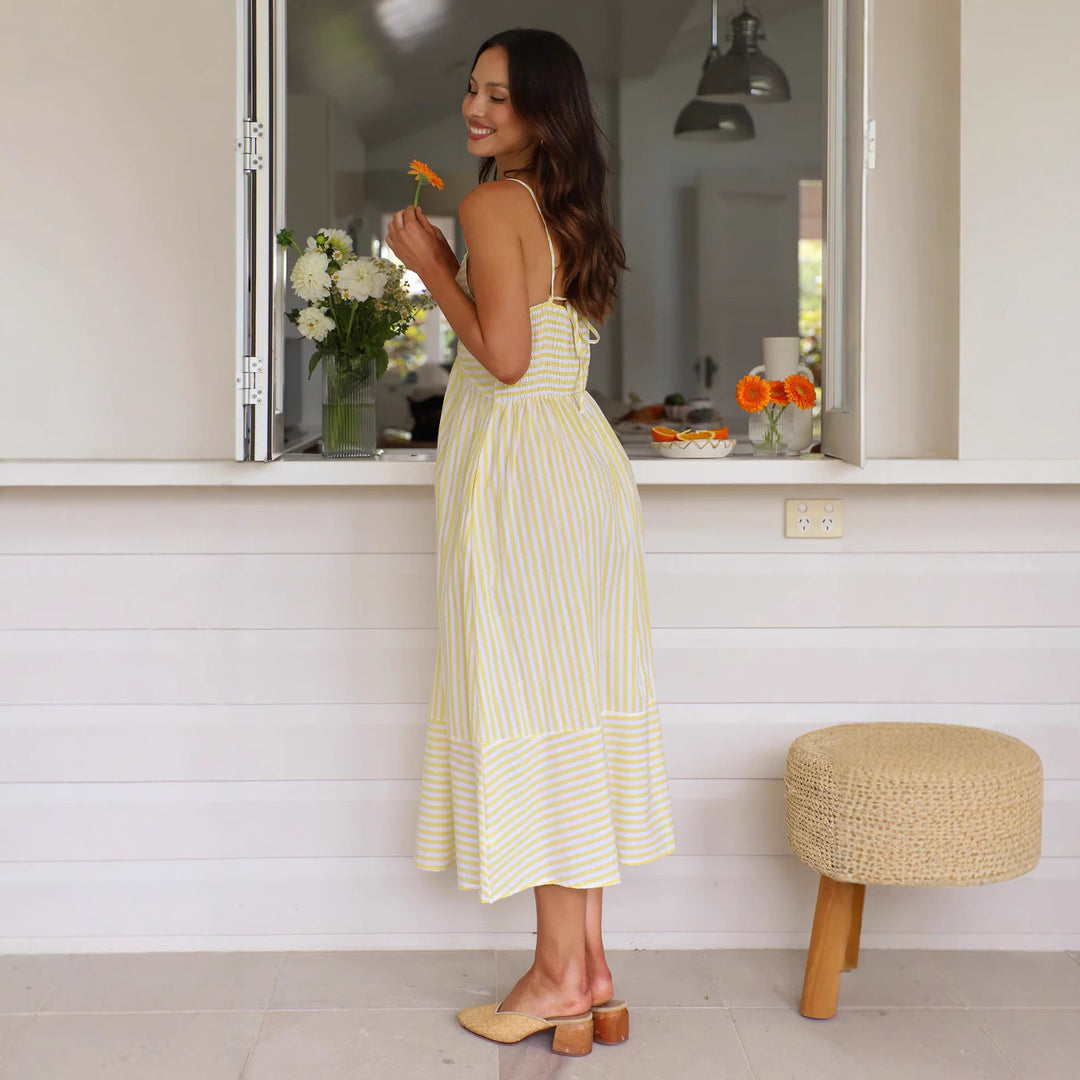 Women's striped maxi dress with playful top and flowing skirt
