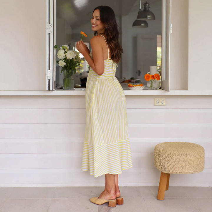 Women's striped maxi dress with playful top and flowing skirt