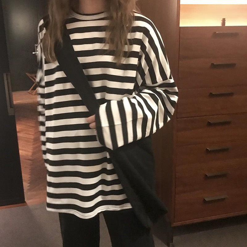 Women's striped long-sleeve shirt with a loose fit and modern details
