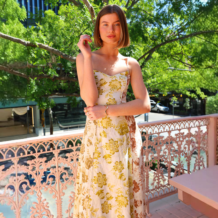 Women's Long Floral Dress with Adjustable Spaghetti Straps and Flowing Cut