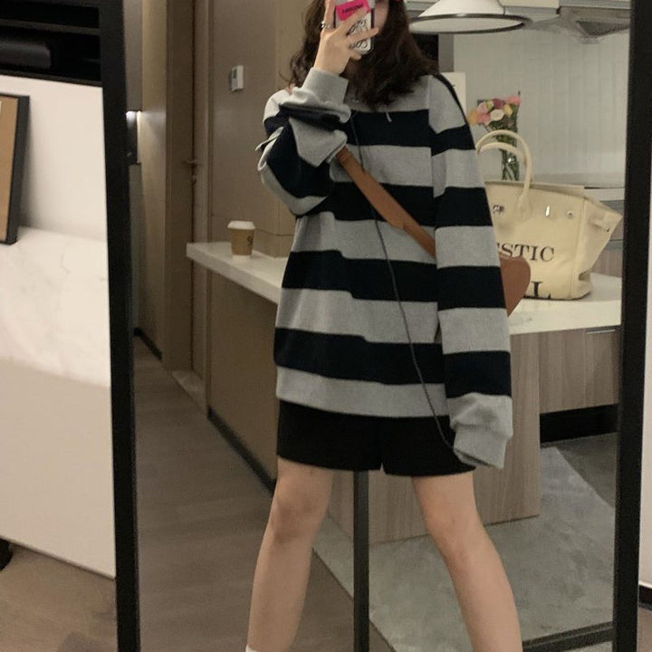 Women's casual knit sweater with wide stripes and cozy oversized fit